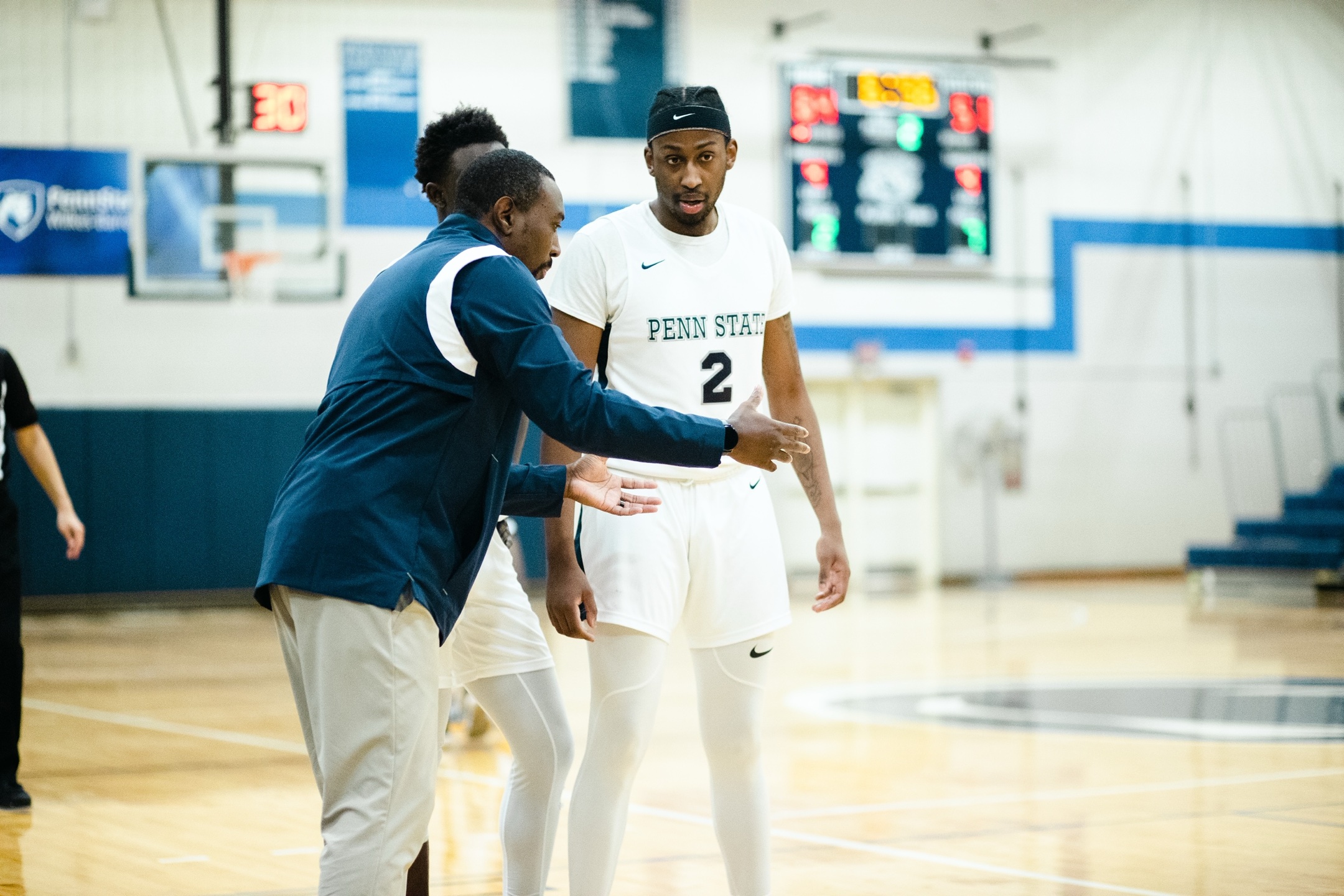 Coach Hammett challenging a player mid-game